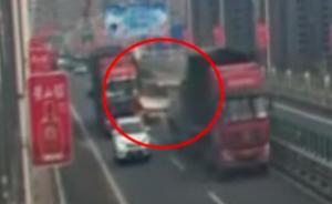 货车司机为捡货物高速路上倒车一公里